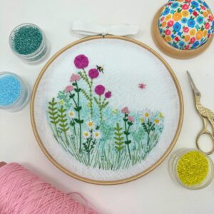A flower garden embroidery hoop available to buy as a kit